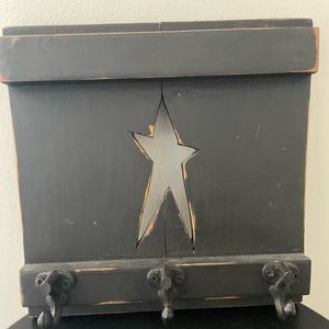 Primitive wall hanger for keys or other objects.